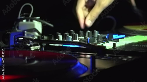 DJ playing with knobs in dace nightclub
