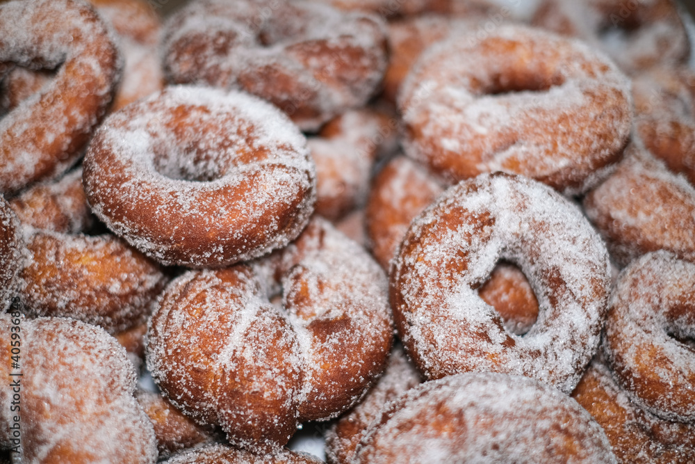 Fried homemade traditional italian doughnuts sweets,fat tasty food.donuts Fried homemade traditional italian doughnuts sweets,fat tasty food.donuts