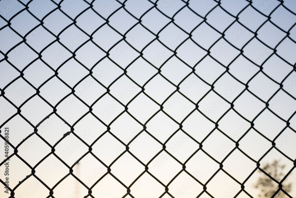 A chain link fence creating a perfect pattern. A chain link fence creating a perfect pattern.