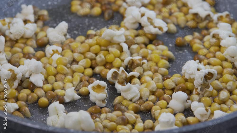 Making popcorn in a frying pan, popcorn day, make popcorn Making popcorn in a frying pan, popcorn day, make popcorn