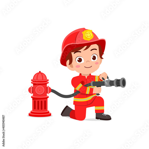 happy cute little kid wearing firefighter uniform and holding hose photo