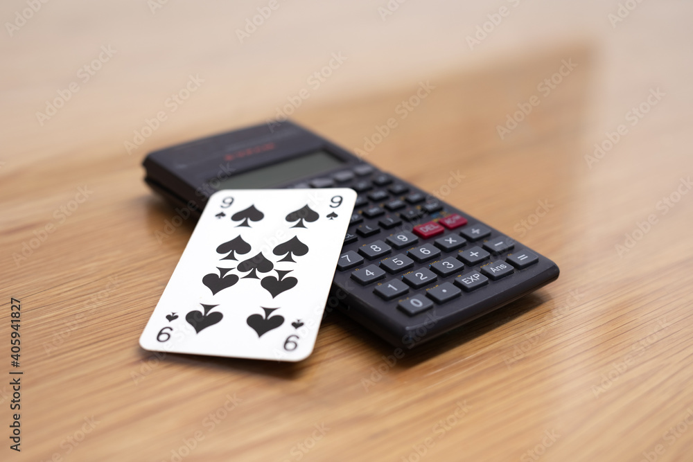 Calculator and playing card black spades nine Calculator and playing card black spades nine
