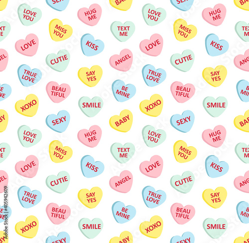 Vector seamless pattern of different color flat cartoon Valentine’s sweet candy with love text isolated on white background