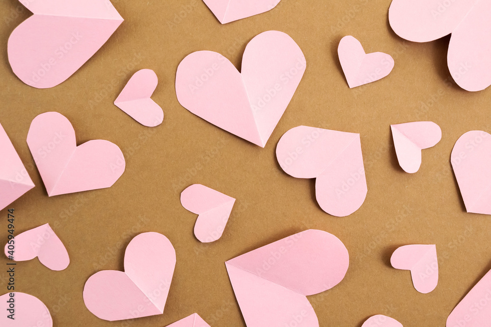 Valentine's Day background. Pink hearts on a craft background. Valentine's Day concept. Layout for postcards and congratulations. Flat lay, top view, copy space Valentine's Day background. Pink hearts on a craft background. Valentine's Day concept. Layout for postcards and congratulations. Flat lay, top view, copy space