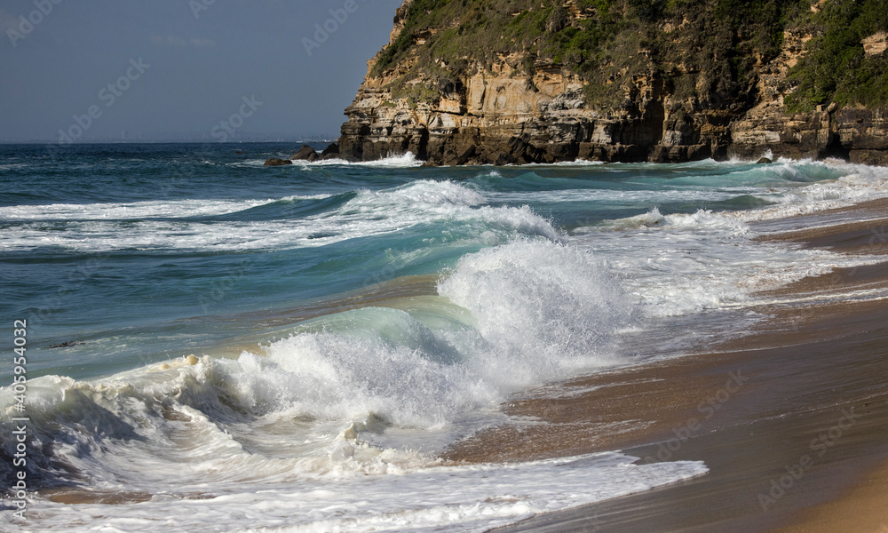 Breaking wave on Stanwell Beach, South Coast of New South Wales Australia