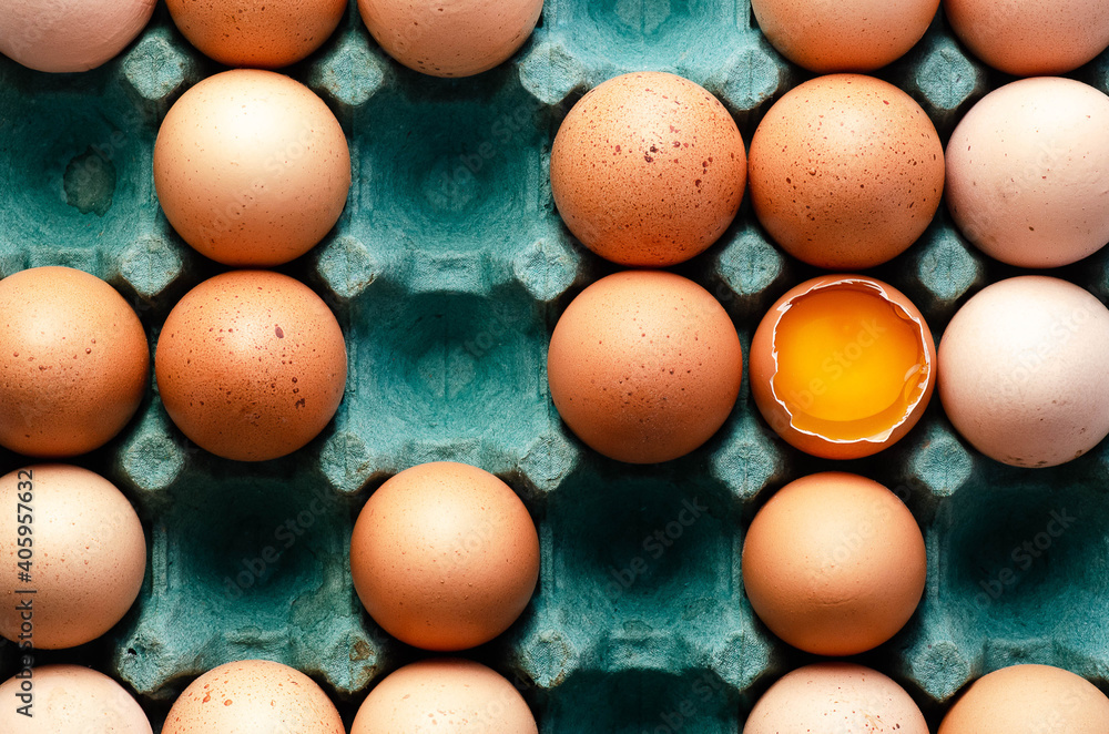 Raw chicken eggs in a turquoise eg box. Raw chicken eggs in a turquoise eg box.