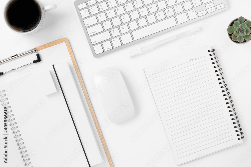 Minimal Office desk table top view with office supply and coffee cup on a white table with copy space, White color workplace composition, flat lay Minimal Office desk table top view with office supply and coffee cup on a white table with copy space, White color workplace composition, flat lay