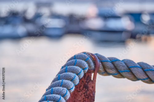 Marine mooring white on the pier close-up.