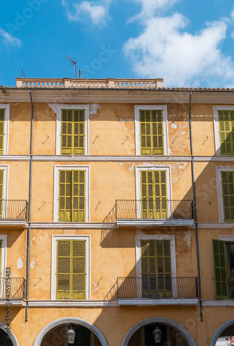 Vertical shot of balconies in the Plaza Mayor in Palma de Mallorca, Spain photo