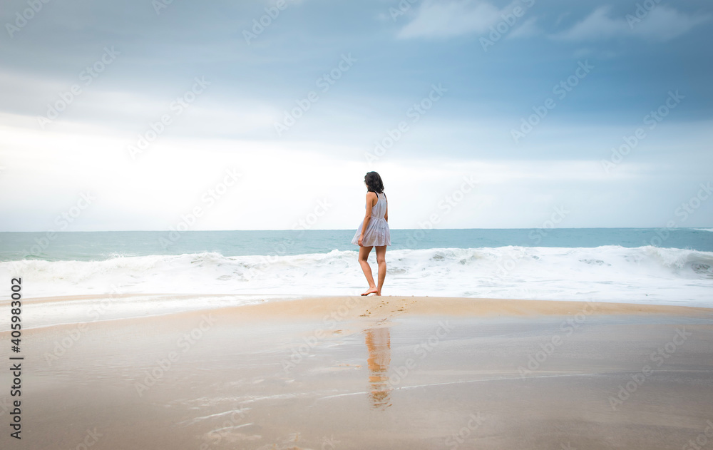 person walking on the beach person walking on the beach