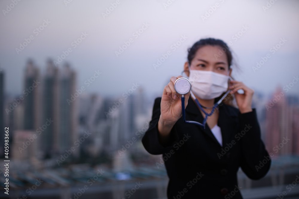 Asian young Business woman wearing face mask because of Air pollution or virus epidemic in the city Asian young Business woman wearing face mask because of Air pollution or virus epidemic in the city