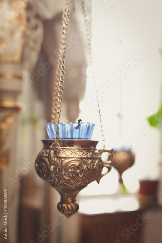 candles and lamp close-up. Interior Of Orthodox Church In Easter. Baby christening. Ceremony a in Christian temple. Bathing the into the baptismal font