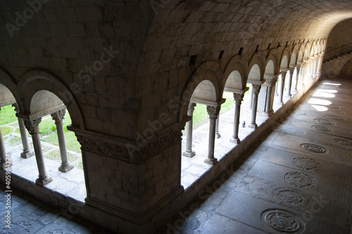 High angle shot of arches and columns within the cloisters in Girona Cathedral, Spain photo