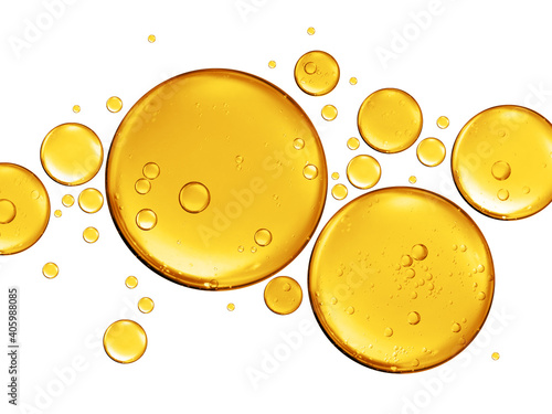 many golden yellow bubble oil or serum isolated on white background