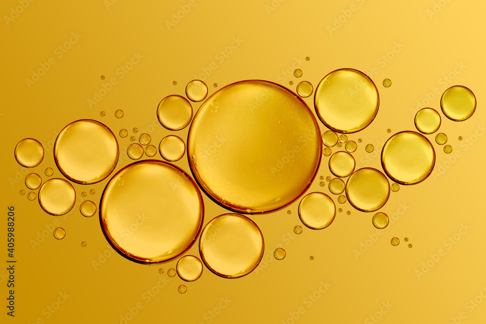 golden drops of oil or serum surface background - obrazy, fototapety, plakaty 