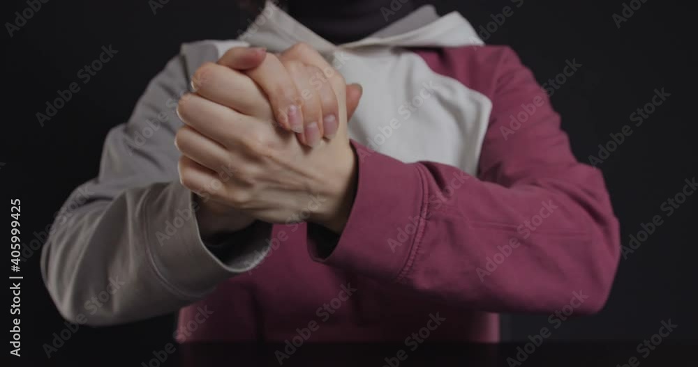 Woman tightly squeezes her palms into the castle Woman tightly squeezes her palms into the castle