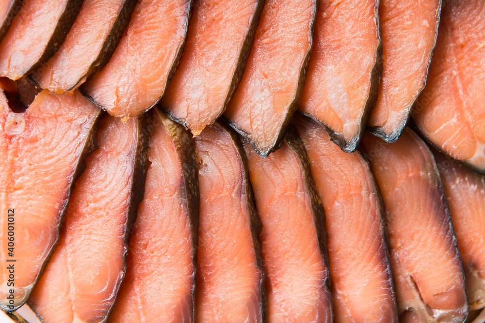 The tender meat of the salmon, cut into thin slices. Delicious cold smoked fish fillet The tender meat of the salmon, cut into thin slices. Delicious cold smoked fish fillet