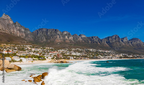 Urban waterfront town cityscape with a rocky mountain range behind in Cape Town, South Africa