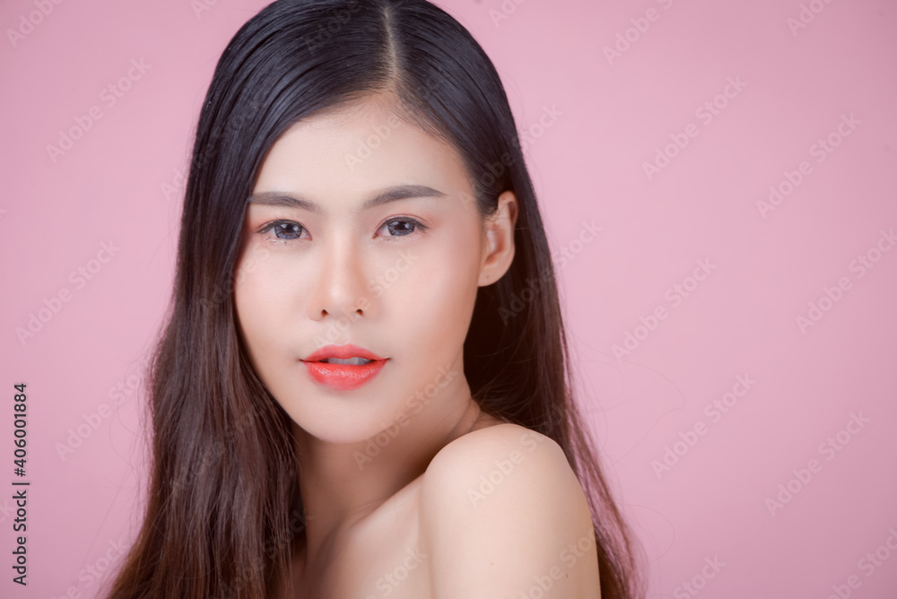 Portrait of a woman using water to wash her face, Beauty Spa Woman with perfect skin Portrait. Asian beautiful woman skin makeup young model,on pink studio Portrait of a woman using water to wash her face, Beauty Spa Woman with perfect skin Portrait. Asian beautiful woman skin makeup young model,on pink studio