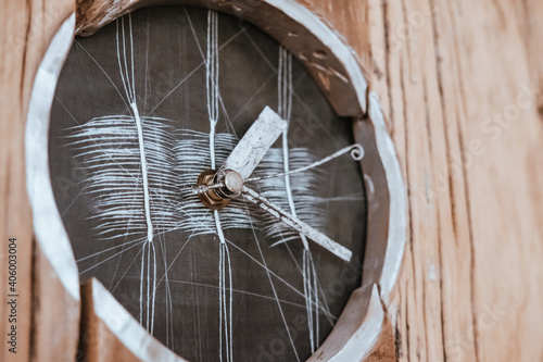 A closeup shot of an old wooden wall clock