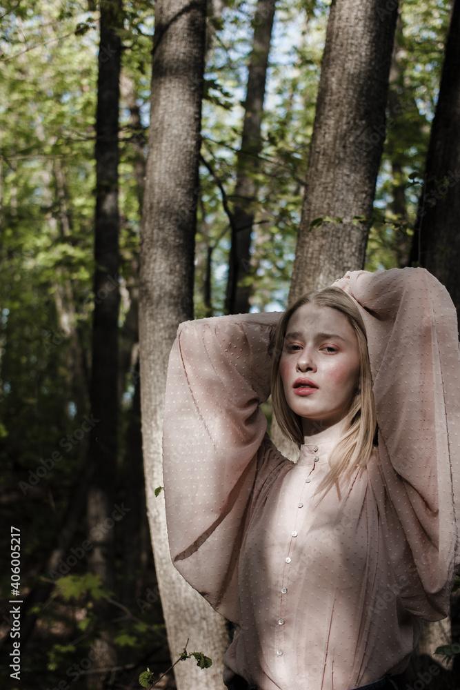 Portrait of a beautiful mysterious woman with blond hair in the forest. like a fairytale. Warm tone
Portrait of a beautiful mysterious woman with blond hair in the forest. like a fairytale. Warm tone