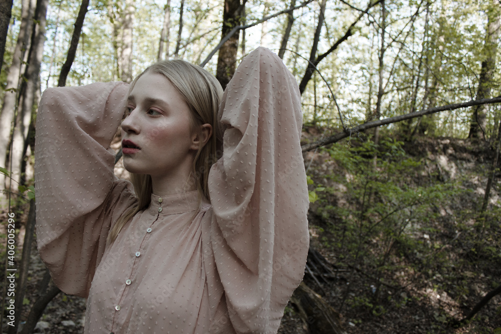Portrait of a beautiful mysterious woman with blond hair in the forest. like a fairytale. Warm tone
Portrait of a beautiful mysterious woman with blond hair in the forest. like a fairytale. Warm tone