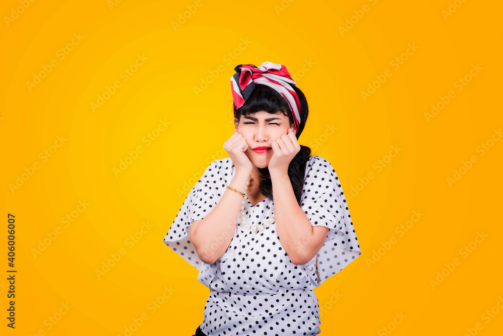 Wow, Closeup red head young woman pretty amazed pinup girl in button shirt excited surprised shocked looking up to side retro vintage 50s hairstyle on yellow wall. Cute face expression Wow, Closeup red head young woman pretty amazed pinup girl in button shirt excited surprised shocked looking up to side retro vintage 50s hairstyle on yellow wall. Cute face expression
