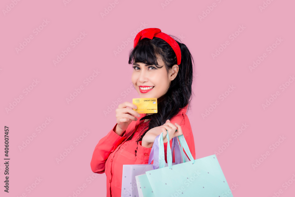 Young smiling Asian woman presenting credit card in hand showing trust and confidence for making payment,Reliable financial company Young smiling Asian woman presenting credit card in hand showing trust and confidence for making payment,Reliable financial company