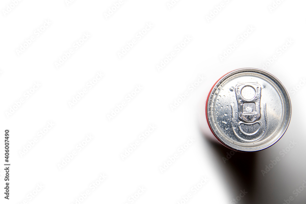 Aluminum can on a white background, with water drops, top view. Aluminum can on a white background, with water drops, top view.