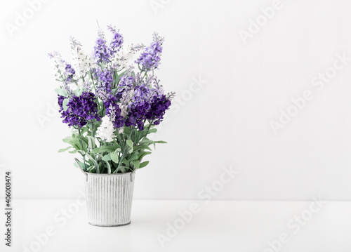 Artificial flower in decorative vintage pot