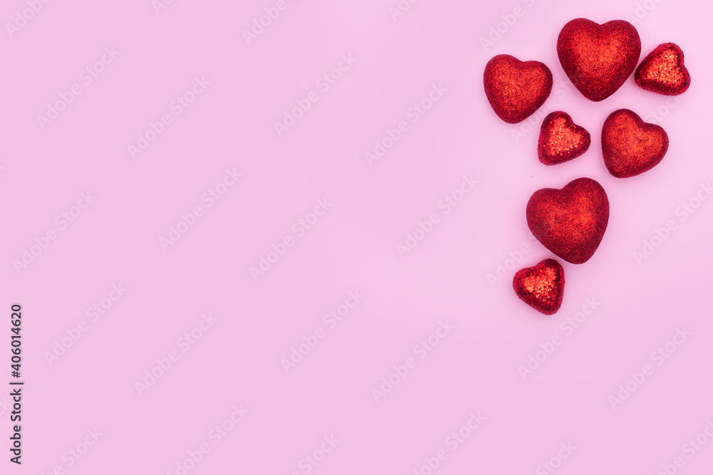 3d red glitter hearts on pink background. Cute Valentine's day backdrop. Red and pink cute love background.