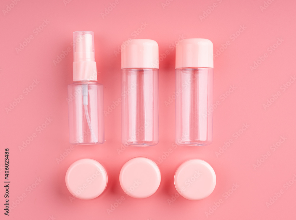 Empty plastic bottles and tubes for cosmetic on pastel pink background Empty plastic bottles and tubes for cosmetic on pastel pink background