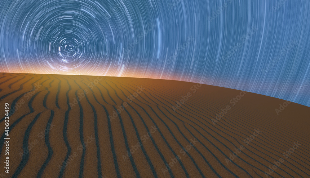 Naklejka premium Long exposure of Star trails in the desert of sand dune
