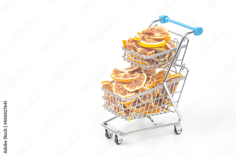 Dried citrus fruits in a market basket on a white background. Vitamin foods