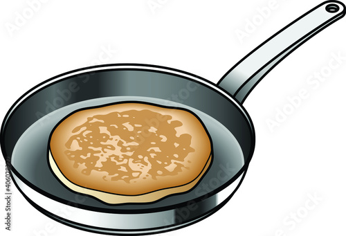 A non-stick frying pan with a pancake / griddle cake / pikelet.