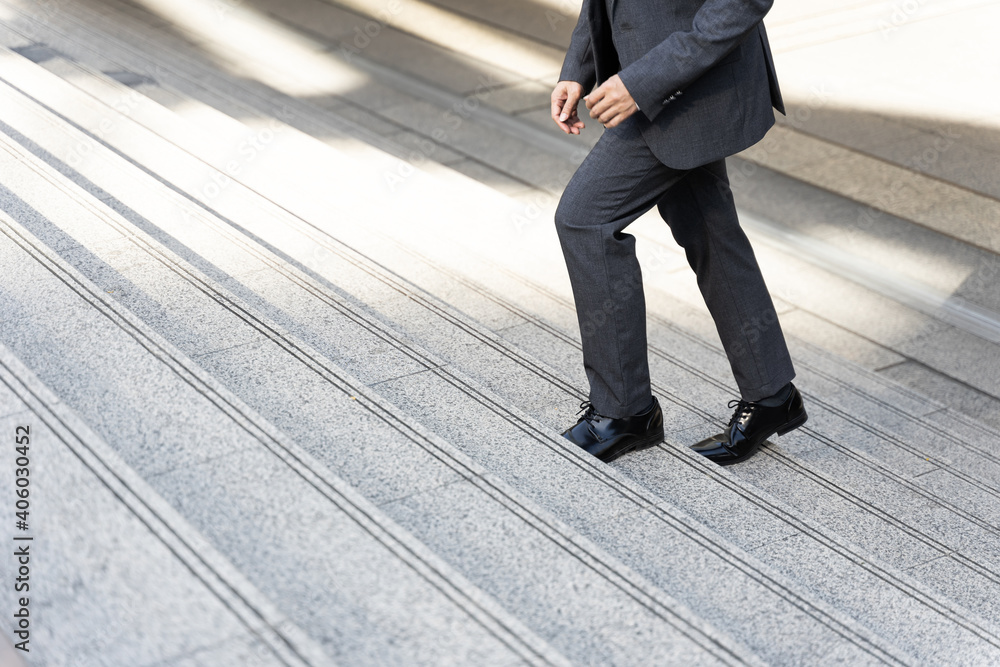 Close up businessman walking stepping up on business district urban, business concept Close up businessman walking stepping up on business district urban, business concept
