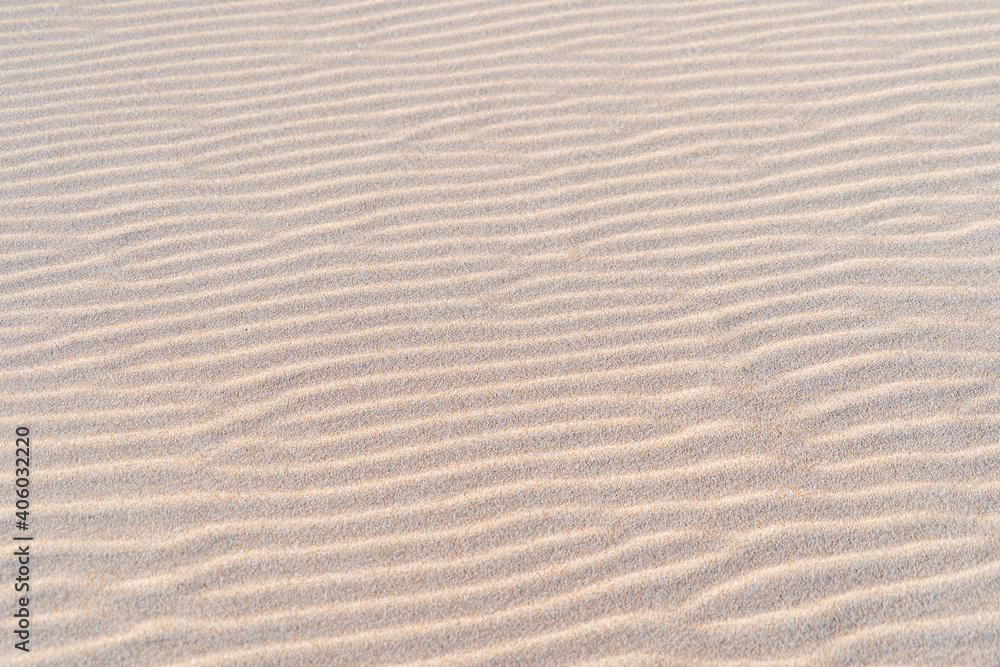 White sand texture waves close up. Wavy background pattern of sandy beach. White sand texture waves close up. Wavy background pattern of sandy beach.