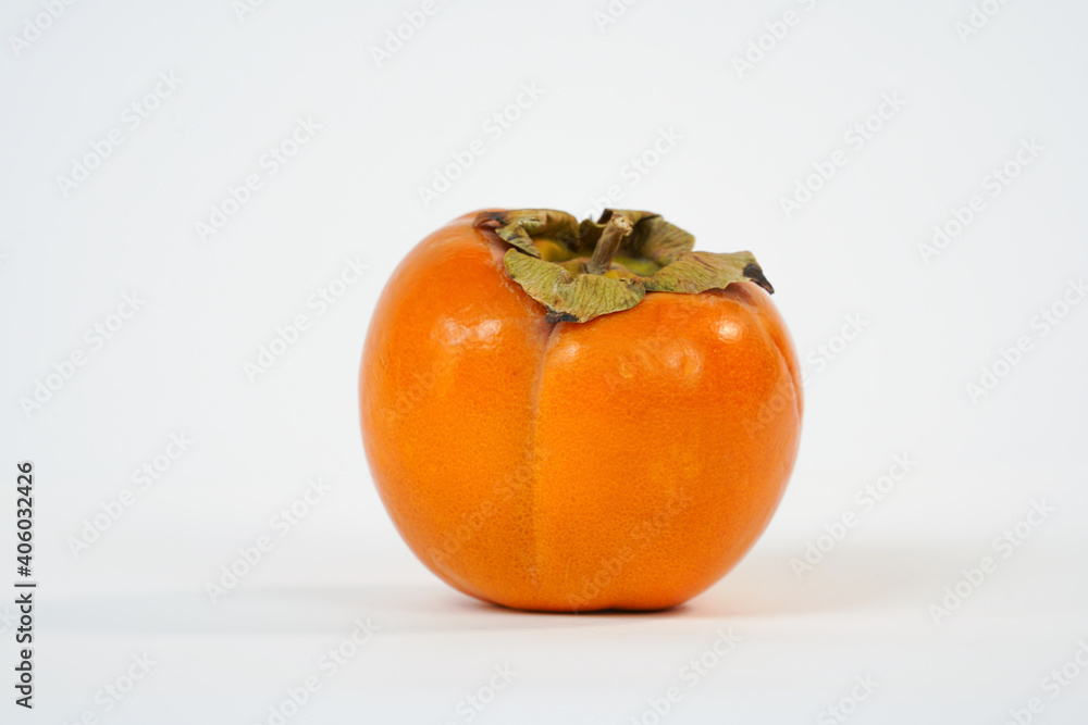 Orange ripe persimmon isolated on white background. Organic goldcrest . Organic, health fruit. Copy space. Food market. Product for sale. Orange ripe persimmon isolated on white background. Organic goldcrest . Organic, health fruit. Copy space. Food market. Product for sale.
