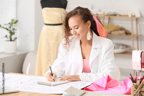 Female fashion designer working in studio