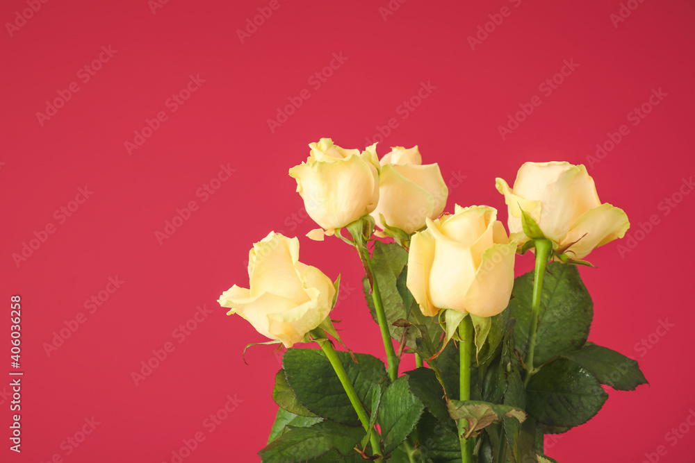 Obraz premium Bouquet of fresh yellow roses with green leaves on a vibrant red background, a symbol of love and celebration