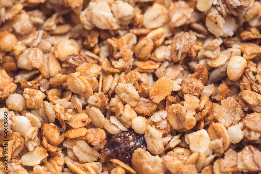 Useful and tasty muesli with nuts, rasins and flakes. Selective focus macro shot with very shallow depth of field. Healthy and vegetarian lifestyle Useful and tasty muesli with nuts, rasins and flakes. Selective focus macro shot with very shallow depth of field. Healthy and vegetarian lifestyle