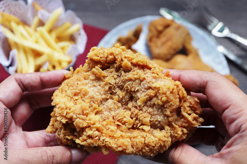 Woman holding fried chicken,Top view.