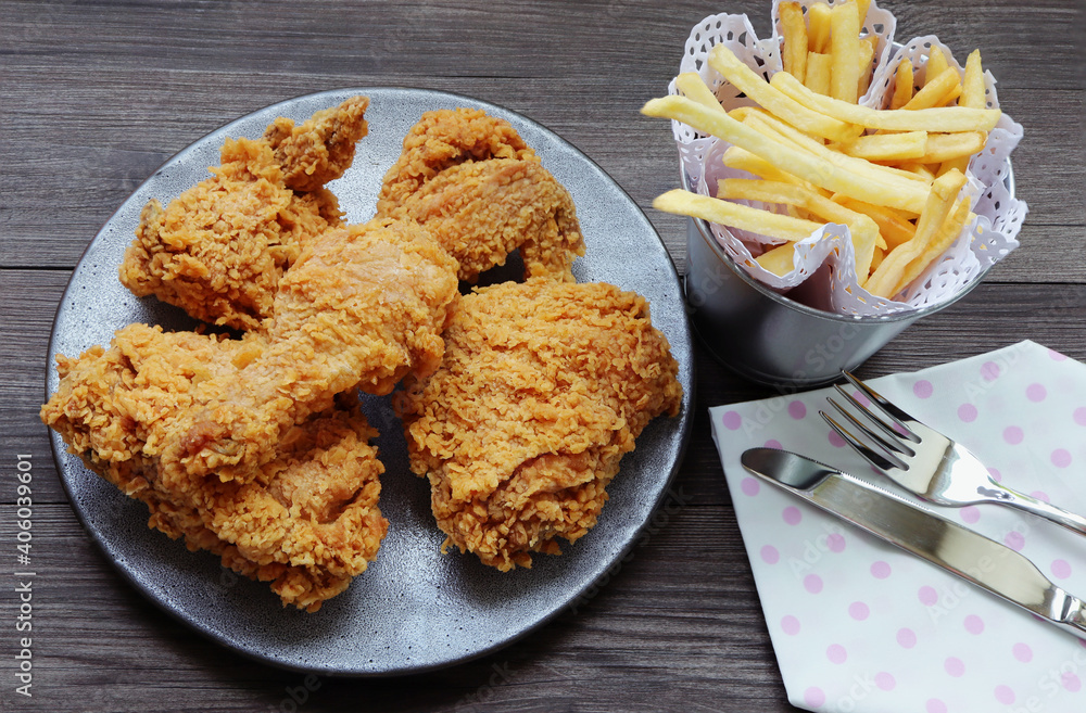 fried chicken with french fries on the table. fried chicken with french fries on the table.
