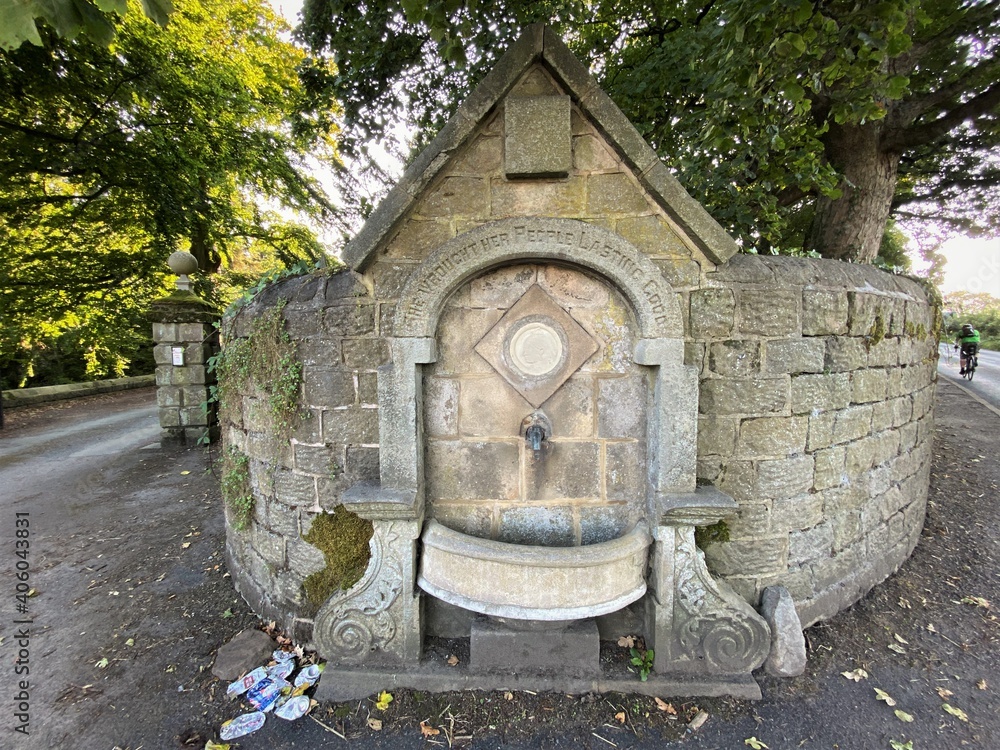 Victorian, public stone drinking fountain, at Farnley Road crossroads in, Farnley, Otley, UK