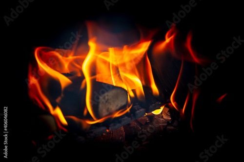 Flame of fire from wooden boards on a black