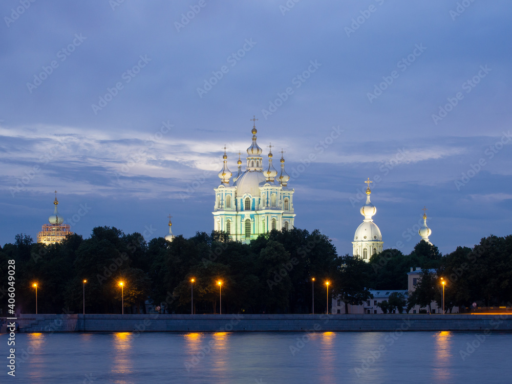 Russia, St. Petersburg - July 19, 2020: View of the Smolny Cathedral from the Neva at night on a cloudy summer day. Russia, Saint-Petersburg