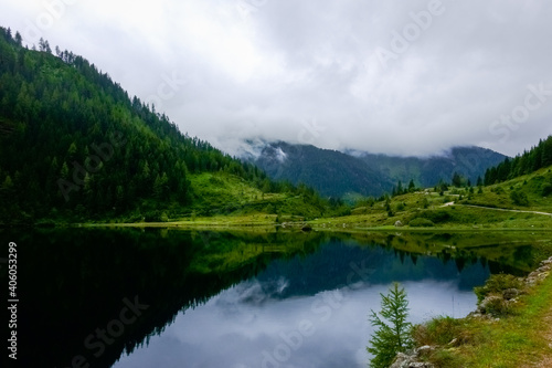 reflection in a mountain lake in the mountains with dense clouds