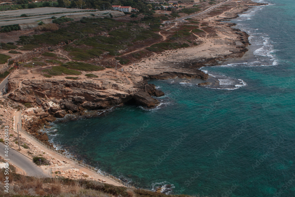 Northern Israeli rocky beach, as seen from the top of the Rosh Hanikra cliffs.