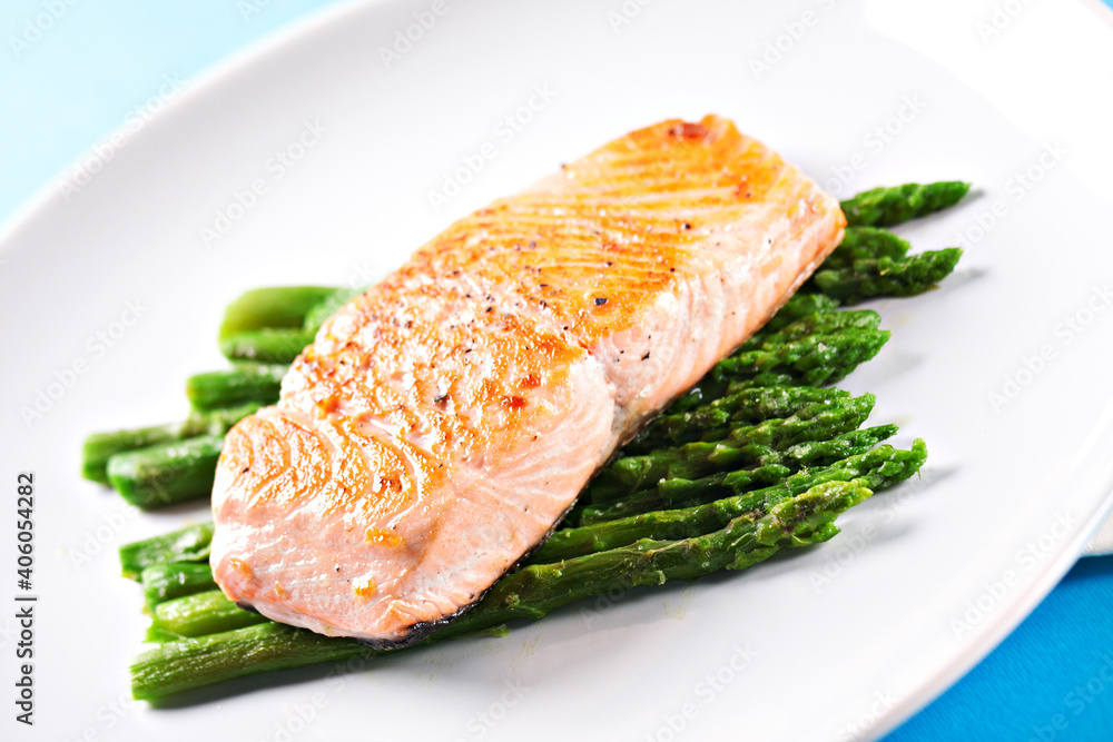 Fillet of salmon with asparagus on a plate. Fillet of salmon with asparagus on a plate.