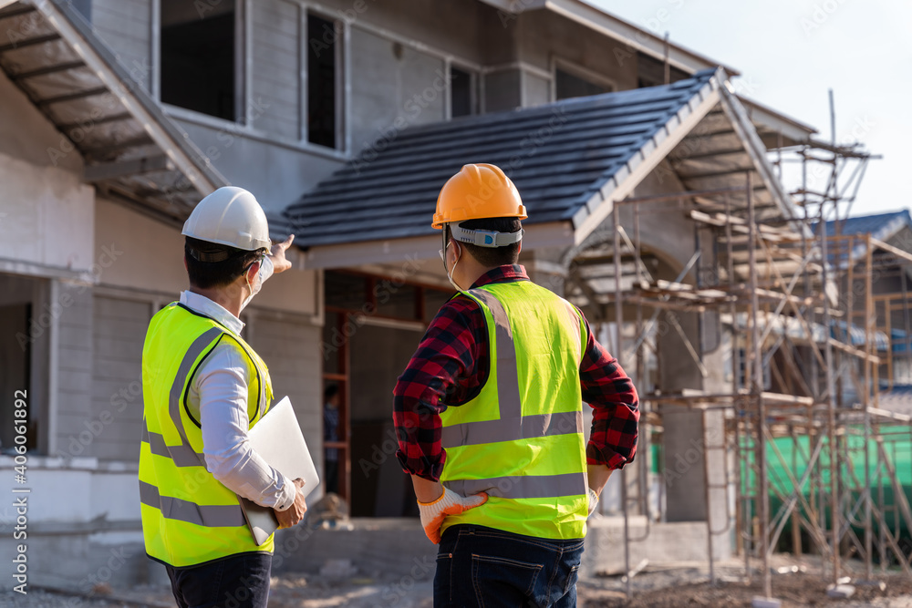 Engineer recommend house construction to supervisor supervisors at construction site. House builder concept. Engineer recommend house construction to supervisor supervisors at construction site. House builder concept.